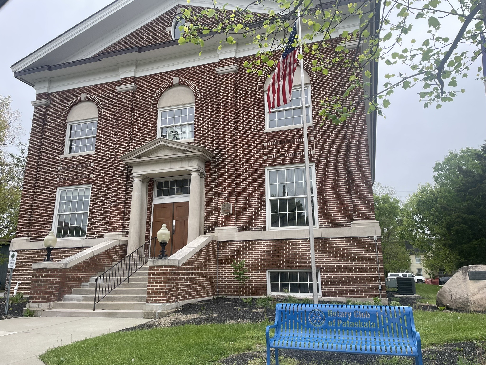 Sterling Theater brick building Pataskala with Rotary Club bench